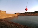 SASAqS 2014 - Dam wall with hazard floats hanging in the air